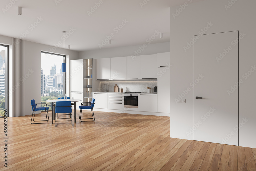 Obraz premium White home kitchen interior with dinner table and seats, cabinet with window