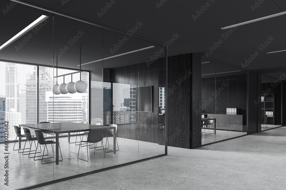 Black glass office room interior with table and chairs, tv display and window