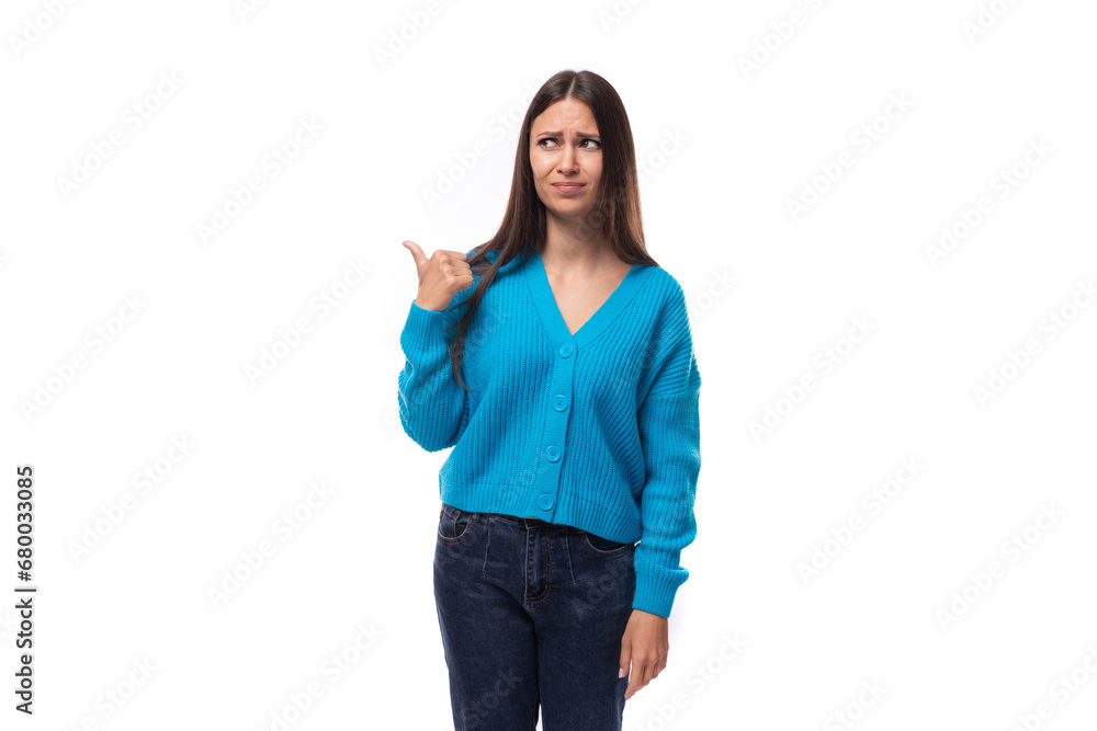 charming cute young woman dressed in a blue pullover reflects on inspiration charming cute young woman dressed in a blue pullover reflects on inspiration
