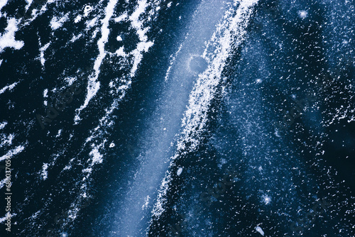 Frozen river and wave covered with ice and snow abstract winter background, effect of space and galaxy © Bogdan