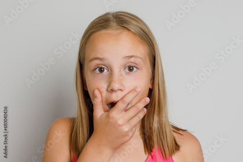 Shocked little child girl close up portrait