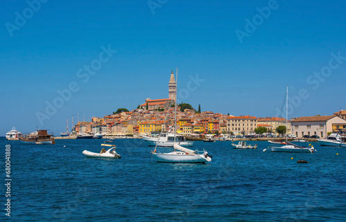Boats on the historic waterfront of the medieval coastal town of Rovinj in Istria, Croatia. Saint Euphemia Church is central © dragoncello