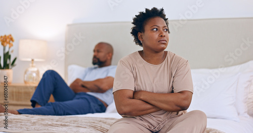 Frustrated black couple, ignore and bed in divorce, fight or conflict for argument or disagreement at home. African woman and man in bad marriage, toxic relationship or breakup in bedroom dispute photo