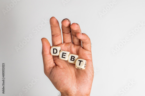 Cupped hand isolated on white background with the word 'debt'