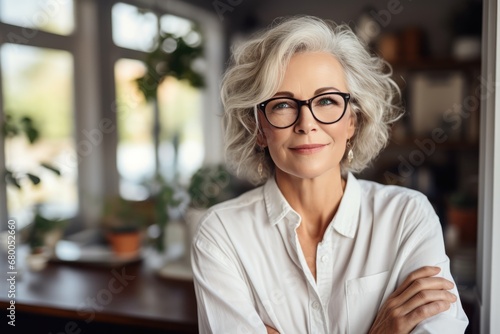 Stylish Mature Woman Standing At Home Office, Arms Crossed