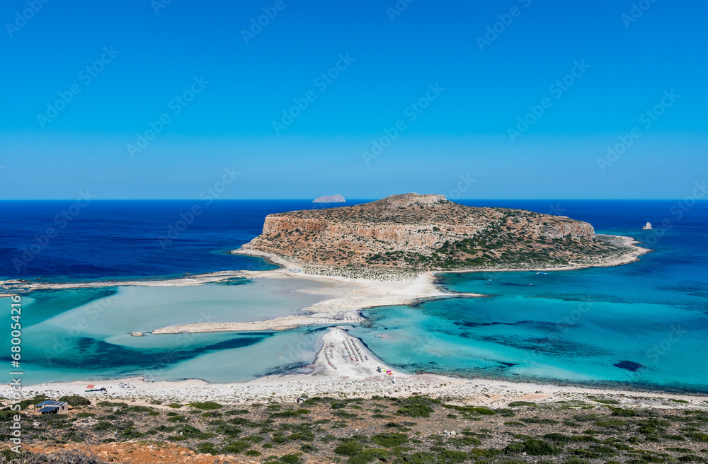 Fototapeta premium Blue lagoon in Balos, Crete, Greece. Beautiful lagoon at Mediterranean Sea. Balos Bay capture on the top of the mountain. View from above on a Gramvousa Island.