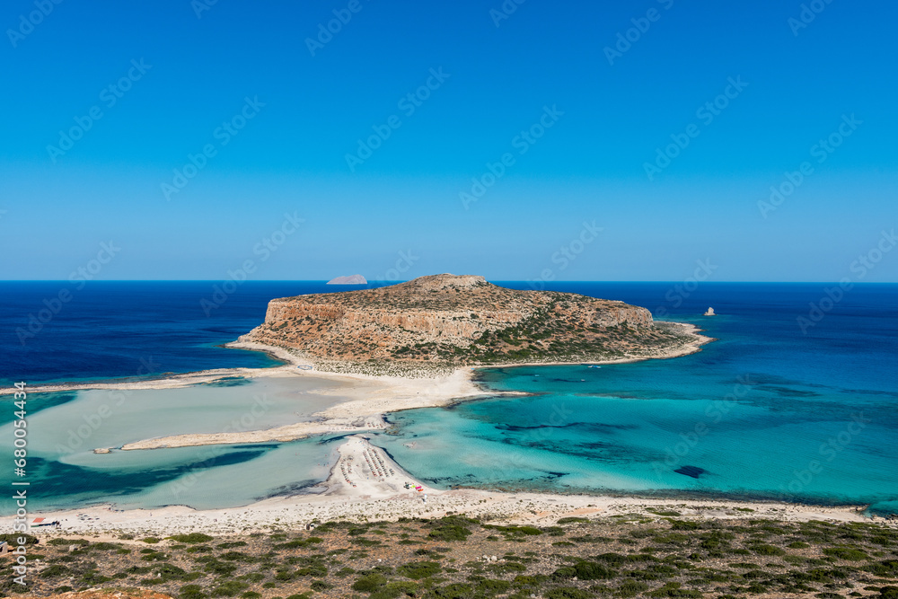 Blue lagoon in Balos, Crete, Greece. Beautiful lagoon at Mediterranean Sea. Balos Bay capture on the top of the mountain. View from above on a Gramvousa Island. - obrazy, fototapety, plakaty 