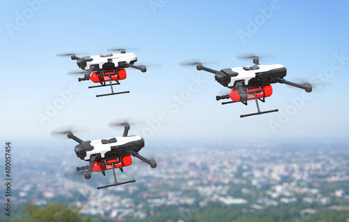 Fototapeta Naklejka Na Ścianę i Meble -  Fire fighting drone concept, Extinguish fire with the drone flying in the sky