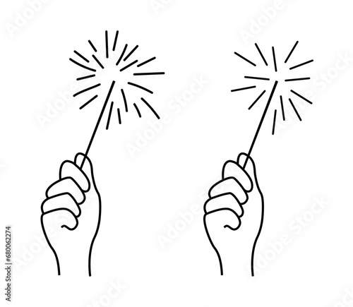 Hand holding a sparkling sparkler