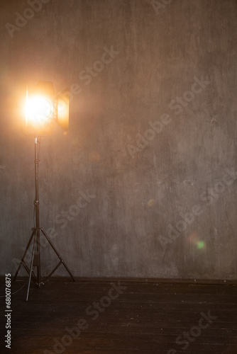flash near a dark background in a photo studio