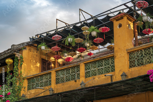 A typical veranda in the ancient town of Hoi An, central Vietnam.  The town is known for it's lanterns and yellow coloured buildings and is a UNESCO World Heritage location