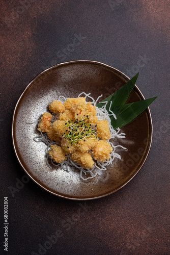 shrimp popcorn and microgreen on a plate