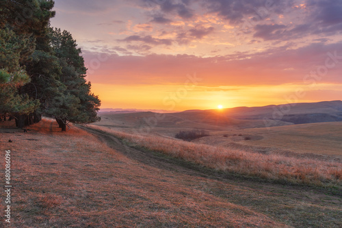 Fototapeta Naklejka Na Ścianę i Meble -  Panoramic view of the sunrise in the mountains valley.