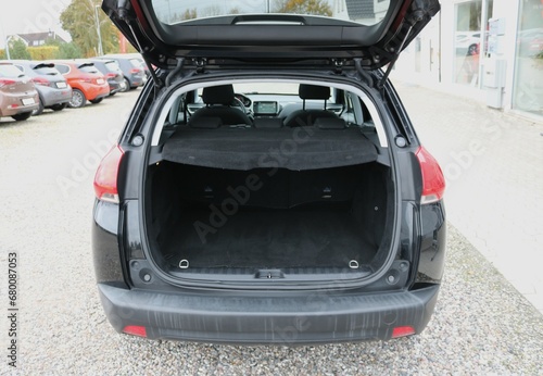 Opened clean modern empty car trunk. © Ustun