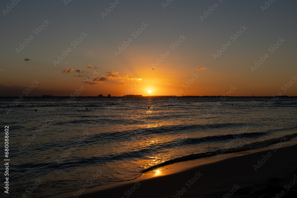 Beautiful sunset on the sea at Isla Mujeres, Mexico Beautiful sunset on the sea at Isla Mujeres, Mexico