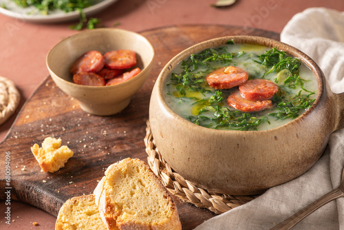 Caldo verde popular soup in Portuguese cuisine. Traditional ingredients for caldo verde are potatoes, onion, garlic, collard greens, chorizo , olive oil and salt. 