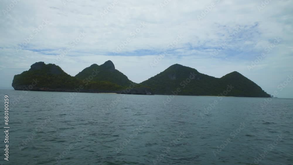 Sailing through limestone islands in Mu Ko Ang Thong National Marine Park in Koh Samui, Thailand Sailing through limestone islands in Mu Ko Ang Thong National Marine Park in Koh Samui, Thailand