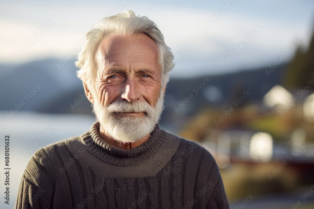 Portrait of a blissful man in his 80s wearing a cozy sweater against a serene lakeside view. AI Generation Portrait of a blissful man in his 80s wearing a cozy sweater against a serene lakeside view. AI Generation