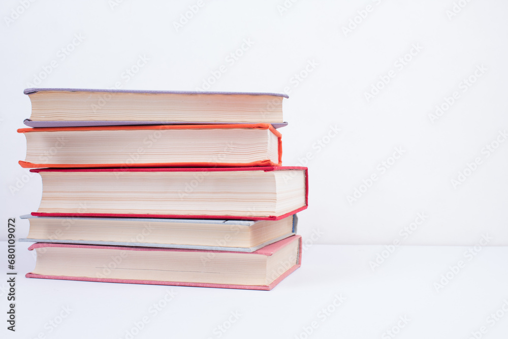 Composition with hardcover books, Books stacking, isolated on white background. Back to school. Copy Space. Education background. Composition with hardcover books, Books stacking, isolated on white background. Back to school. Copy Space. Education background.