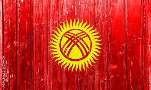 Flag of Kyrgyz Republic on a textured background. Concept collage.