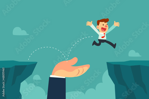 businessman jump on helping hand to cross cliff gap