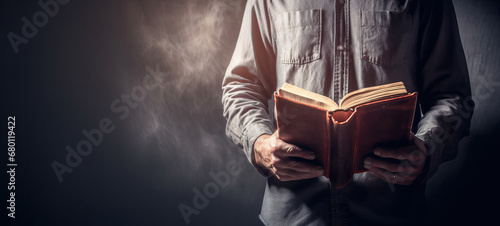 Bible Study Banner with Copyspace, Man Reading Bible photo