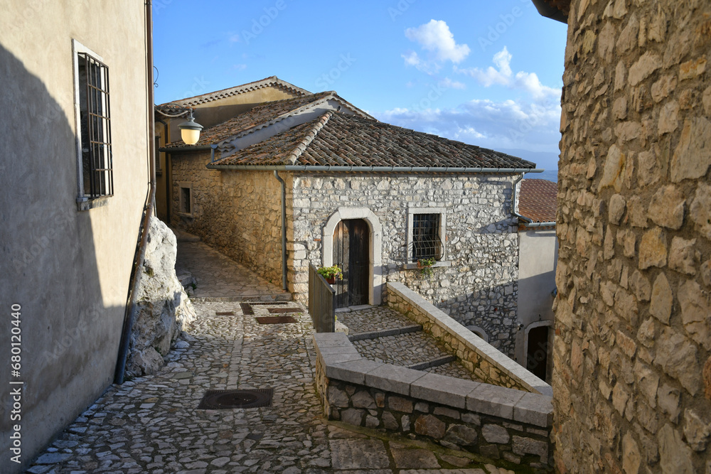 Naklejka premium A narrow street between the old houses of Gesualdo, a medieval village in Campania, Italy.