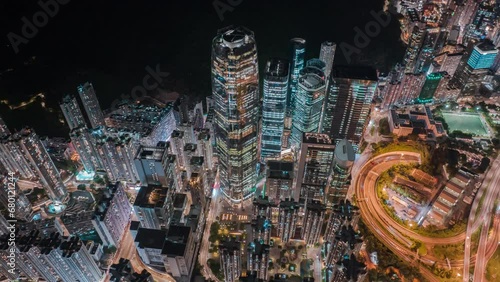 Top View Hyperlapse of Office and Business Districts in Hong Kong City Aerial view city streets at night, Establishing shot for Innovation technology and transportation Concept