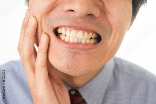 歯が痛いスーツの男性 photo