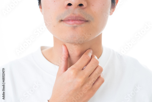 喉を抑える男性 photo
