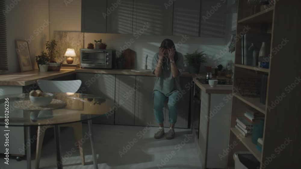 Long shot of spouses fighting at kitchen, husband pushing his wife, domestic violence concept Long shot of spouses fighting at kitchen, husband pushing his wife, domestic violence concept