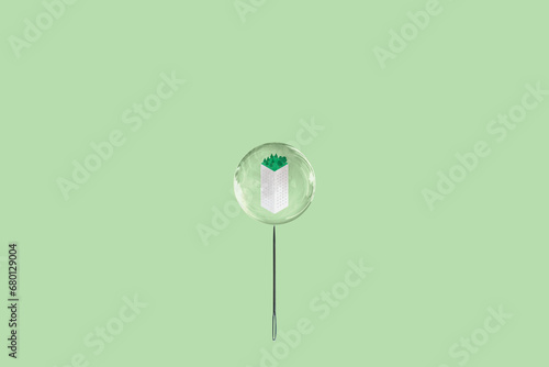 Housing Market Bubble or Real Estate Bubble. Isometric Building in Soap Bubble with Needle. Abstract Concept Image.