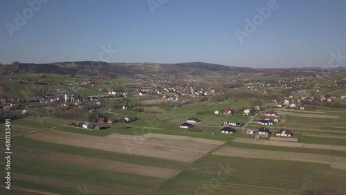 Biezdziadka, Poland - 4 9 2019: Panorama from a bird's eye view. Central Europe: The Polish village of Kolaczyce is located among the green hills. Temperate climate. Flight drones or quadrocopter. photo