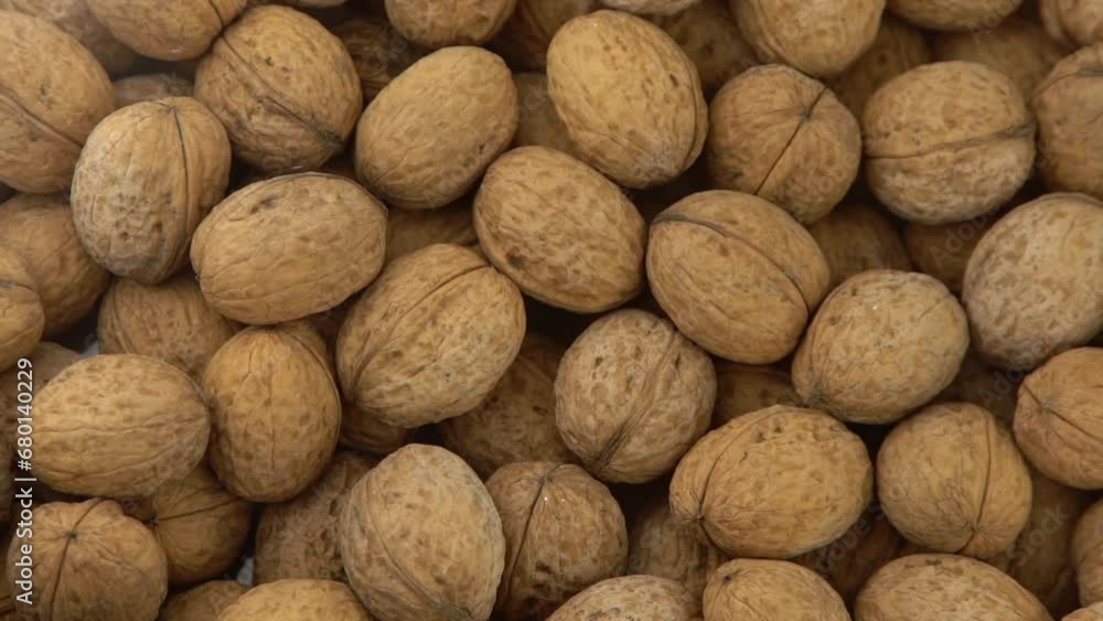 Walnut in shell. Background view from above. Healthy food top view