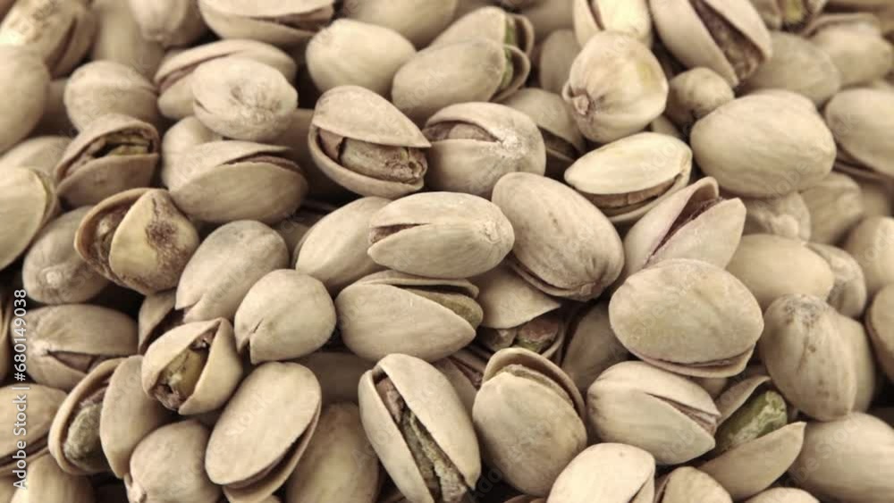 Pistachios in a wooden bowl. Wooden background. Healthy food Pistachios in a wooden bowl. Wooden background. Healthy food