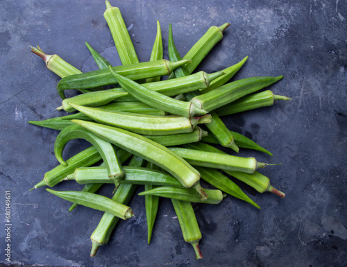 Fresh organic vegetables Lady's Finger or Okra on the Dark concrete floor