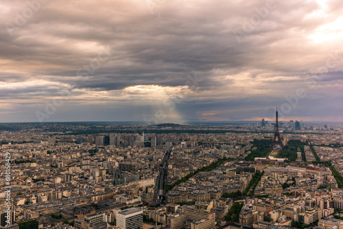 A colorful sunset on Paris before the rain in summer © gdefilip