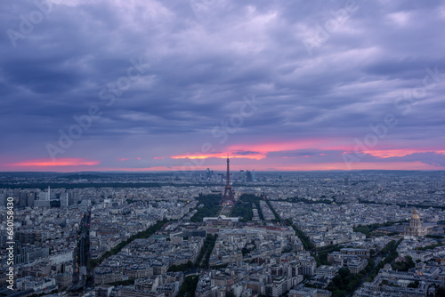 A colorful sunset on Paris before the rain in summer © gdefilip