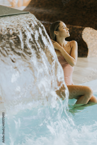 Young woman relaxing by the...