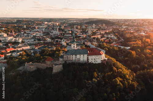 Nitra Castle and streets of Nitra city on sunset - autumn time. Aerial view of beautiful and fairytale Nitra Castle. photo