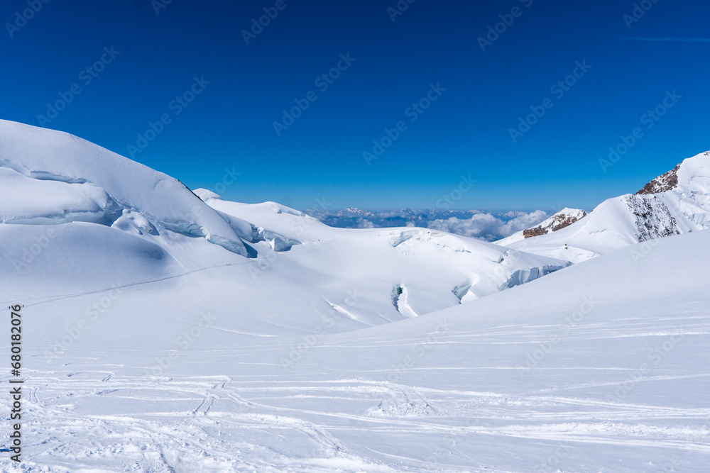 Winter snow covered mountain peaks in Europe. Great place for winter sports. Monte rosa massiv or Dufourspitze in Swiss Alps. The Spaghetti Tour is a traverse of the Monte Rosa massif.