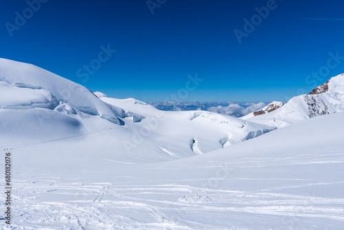 Winter snow covered mountain peaks in Europe. Great place for winter sports. Monte rosa massiv or Dufourspitze in Swiss Alps. The Spaghetti Tour is a traverse of the Monte Rosa massif. © Martin