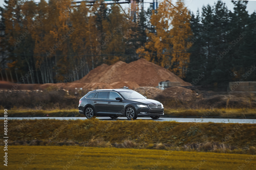 A New and Modern Station Wagon Car on the Highway. A Spacious and Elegant Vehicle for Family and Sport. How to Combine Practicality and Style in a Car. A Combi Car with a Powerful Engine.