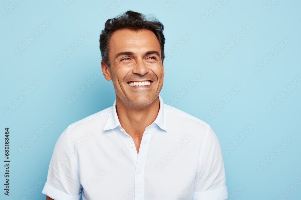 Portrait of a jovial man in his 40s wearing a classic white shirt against a pastel blue background. AI Generation Portrait of a jovial man in his 40s wearing a classic white shirt against a pastel blue background. AI Generation