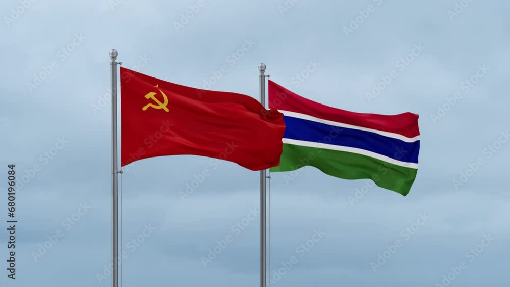Gambia flag and Soviet Union or USSR flag waving together on cloudy sky, endless seamless loop, two country relations concept Gambia flag and Soviet Union or USSR flag waving together on cloudy sky, endless seamless loop, two country relations concept