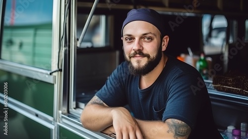 Portrait of a caucasian man cook seller of a street food truck, inside of food truck with crossed arms