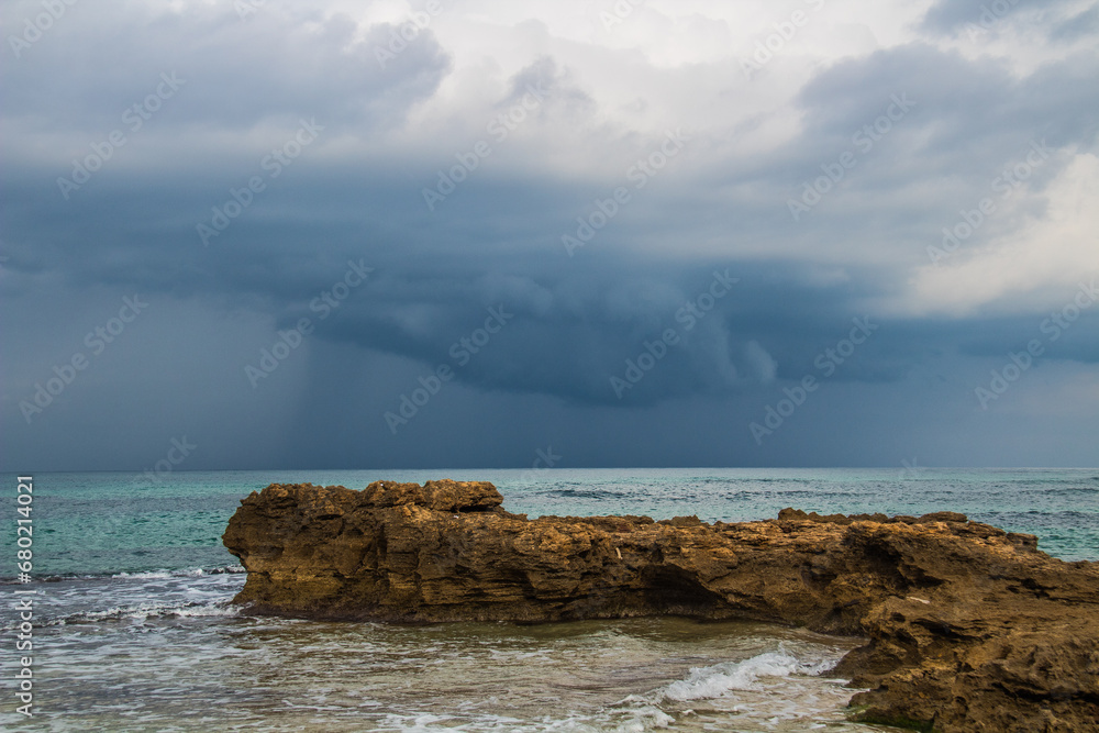 Rocky Beach with Cloudy Sky: Cap Serrat's Coastal Beauty in Bizerte, Tunisia