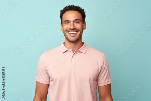 Portrait of a happy man in his 30s wearing a sporty polo shirt against a pastel or soft colors background. AI Generation