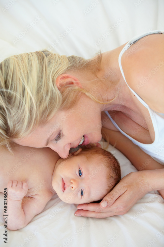 Relax, bed and mother holding baby, bonding with woman and kid lying in home together. Calm morning, mom and newborn in bedroom for rest, love and support in growth, comfort and child care from above Relax, bed and mother holding baby, bonding with woman and kid lying in home together. Calm morning, mom and newborn in bedroom for rest, love and support in growth, comfort and child care from above