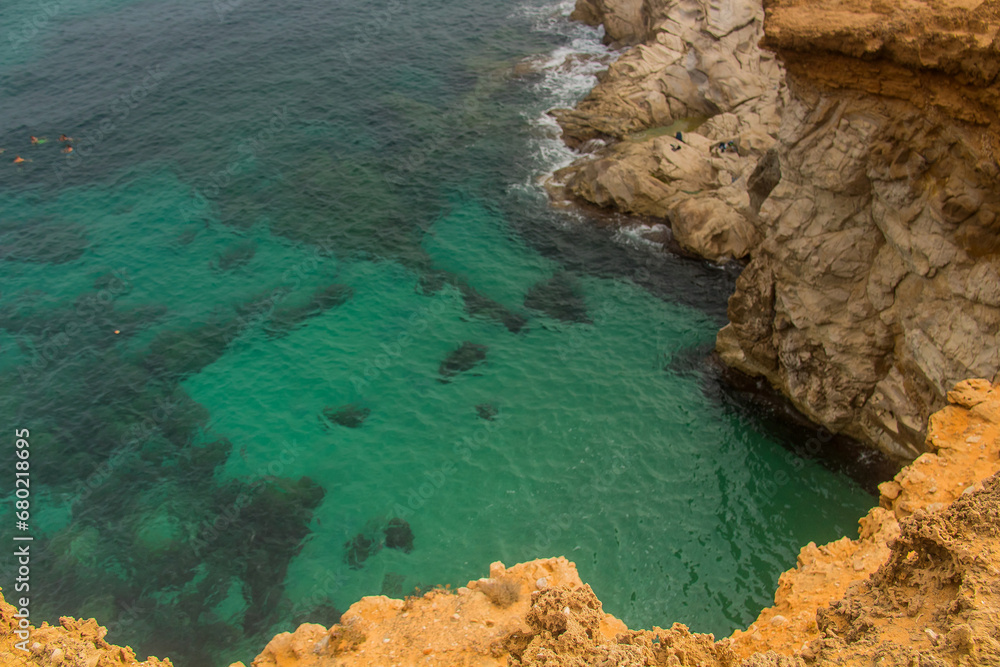 Rock-Studded Beach Beneath a Cliff in Tunisia
